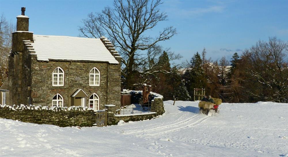 The exterior of Rose Castle Cottage in the snow, Coniston, Lake District, Cumbria