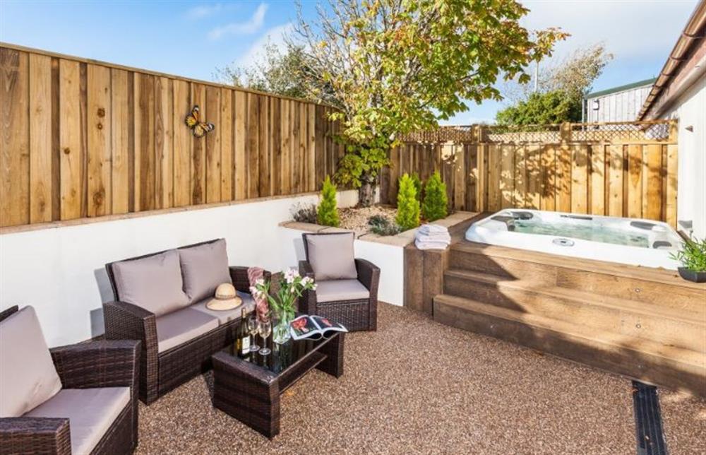 Relax in the private garden with a Villeroy and Boch hot tub at Rose Cottage at Bumbledown, Cornwall at Rose Cottage at Bumbledown, Truro