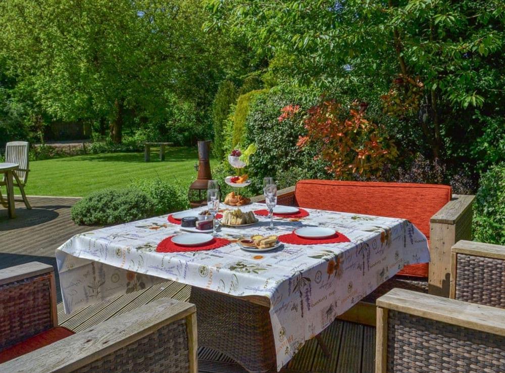 Enjoy afternoon tea on the patio at Rose Cottage in Bratoft, near Burgh-le-Marsh, Lincolnshire