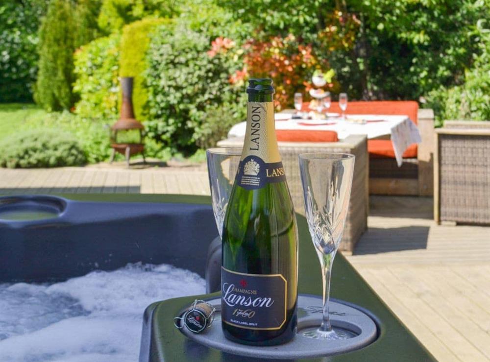 Relax in the hot tub on the patio at Rose Cottage in Bratoft, near Burgh-le-Marsh, Lincolnshire