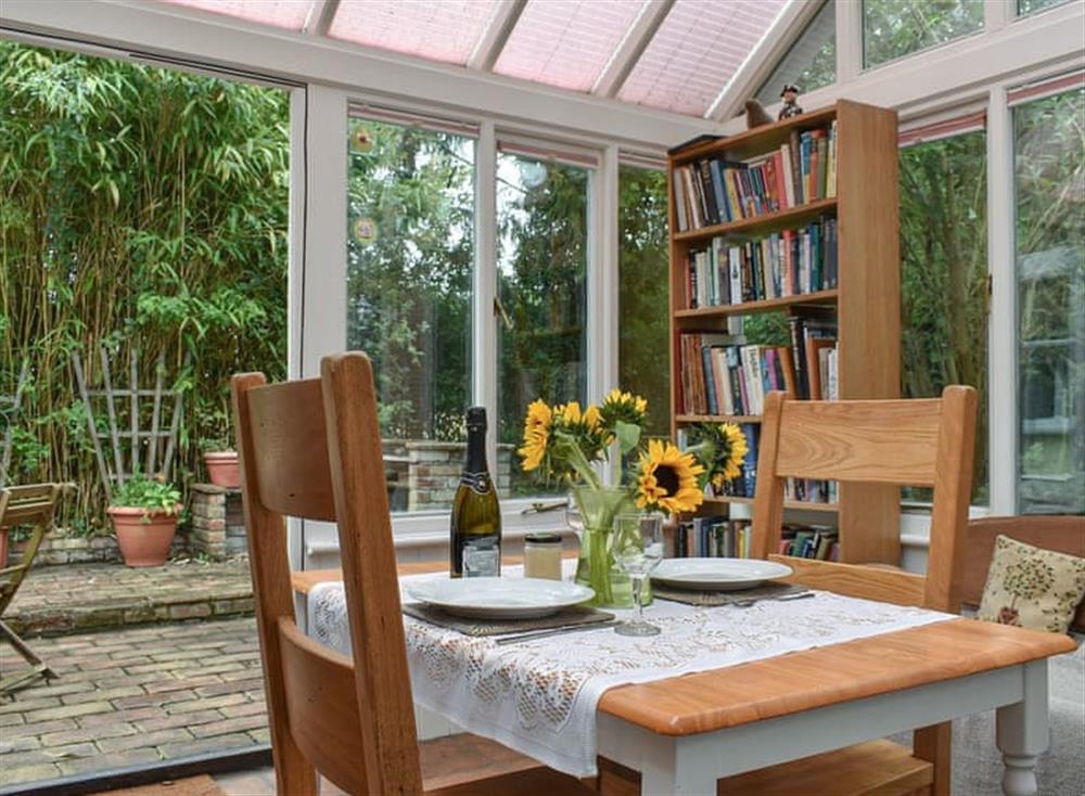 Conservatory with dining area at Rose Cottage in Bressingham, near Diss, Norfolk