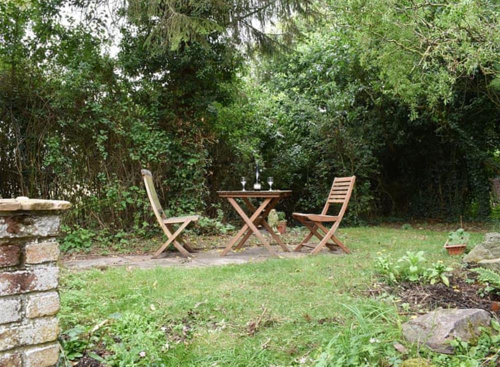 Garden with seating area at Rose Cottage in Bressingham, near Diss, Norfolk