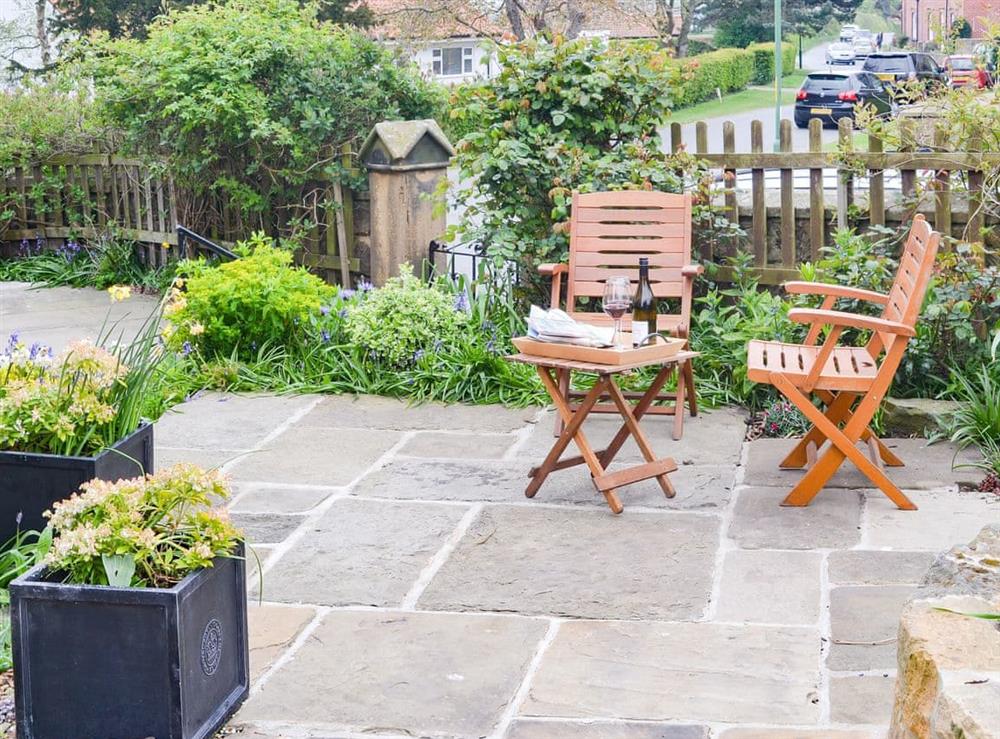 Paved patio area with seating at Rose Cottage in Fylingthorpe, near Whitby, Yorkshire, North Yorkshire