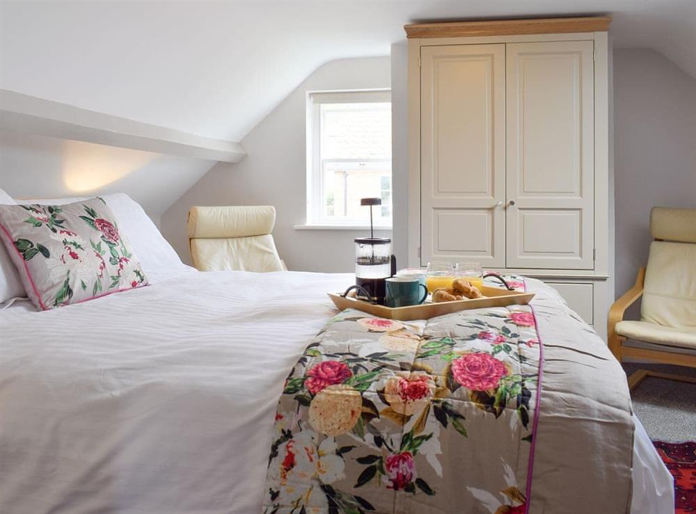 Relaxing upper floor double bedroom at Rose Cottage in Fylingthorpe, near Whitby, Yorkshire, North Yorkshire