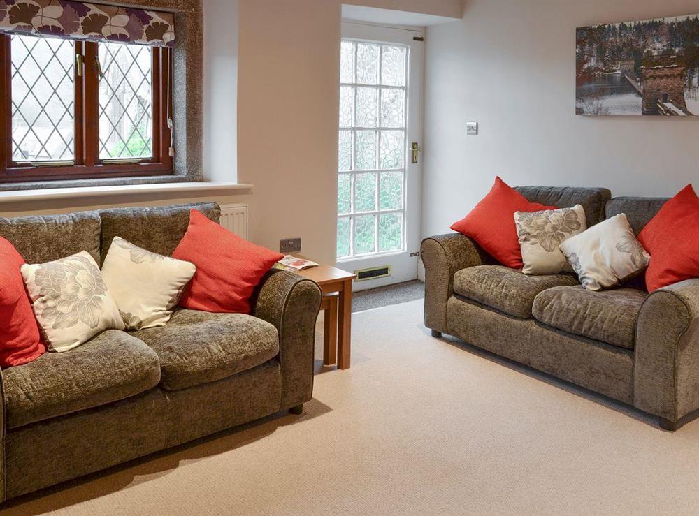 Comfy seating in living room at Rose Cottage in Grindleford, near Bakewell, Derbyshire