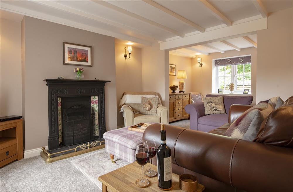 Further sitting room with feature, ornamental fireplace