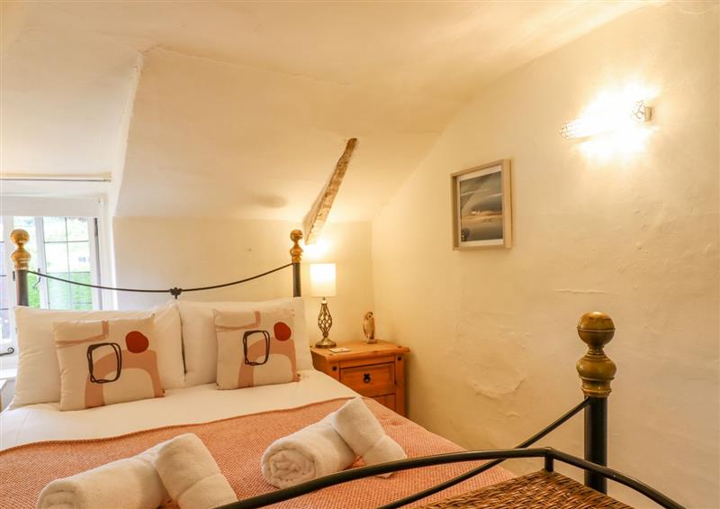 This is a bedroom at Rose Cottage in Holcombe, Teignmouth