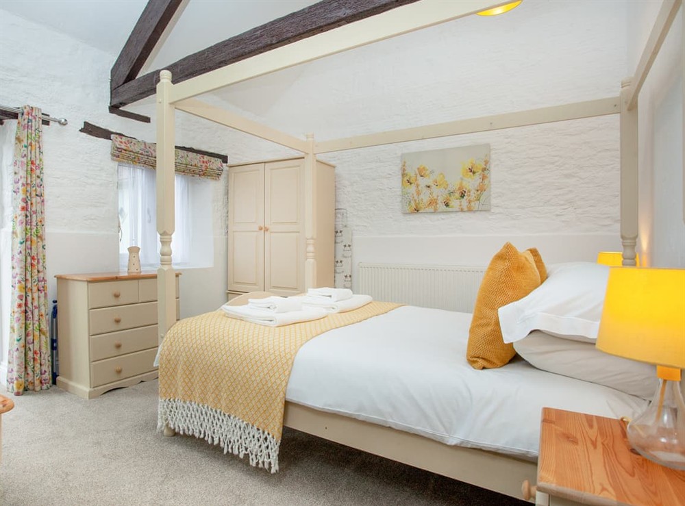 Four Poster bedroom at Rose Cottage in Marldon, near Paignton, Devon