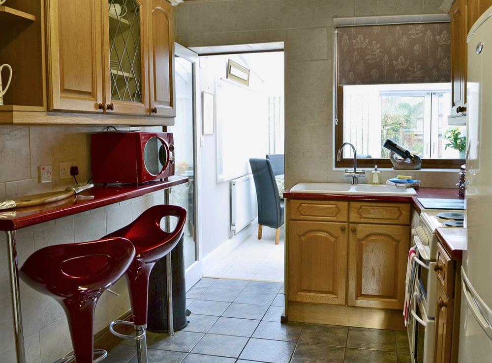 Immaculately presented kitchen with breakfast bar (photo 2) at Rose Cottage in Norham, near Berwick-upon-Tweed, Northumberland