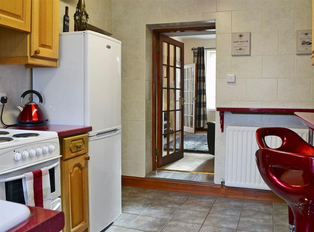 Immaculately presented kitchen with breakfast bar at Rose Cottage in Norham, near Berwick-upon-Tweed, Northumberland
