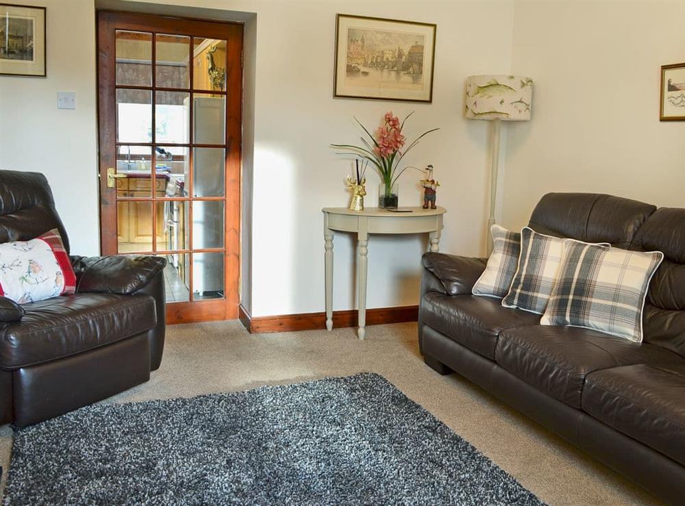 Warm and welcoming living room with open fire (photo 2) at Rose Cottage in Norham, near Berwick-upon-Tweed, Northumberland