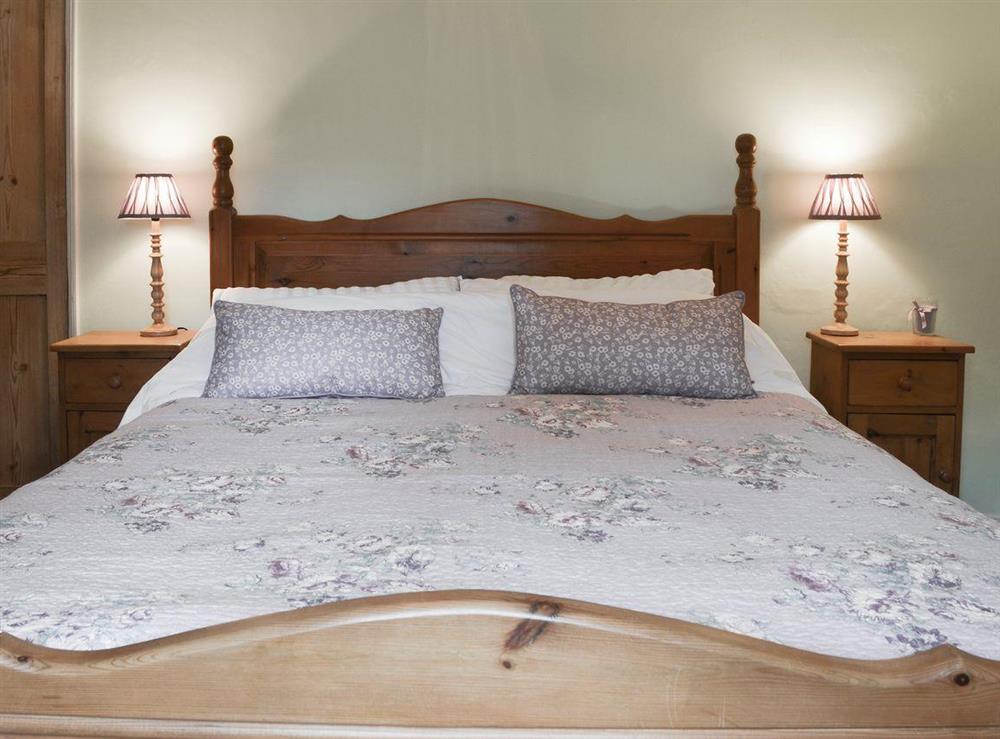 Elegant bedroom with king-size bed at Rose Cottage in Saffron Walden, Essex