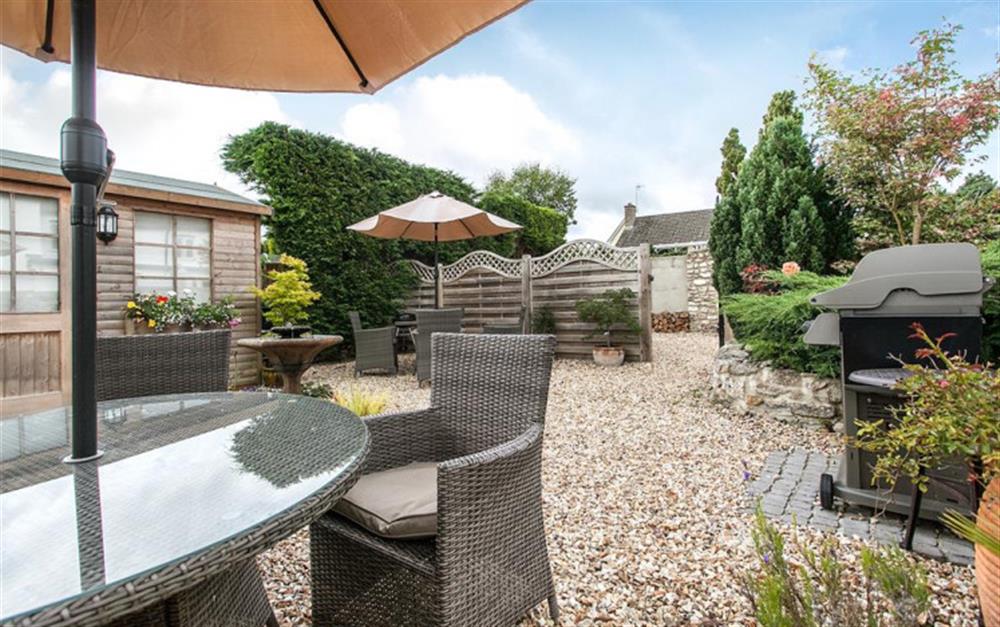 Garden furniture and barbecue provided for guests at Rose Cottage in Seaton