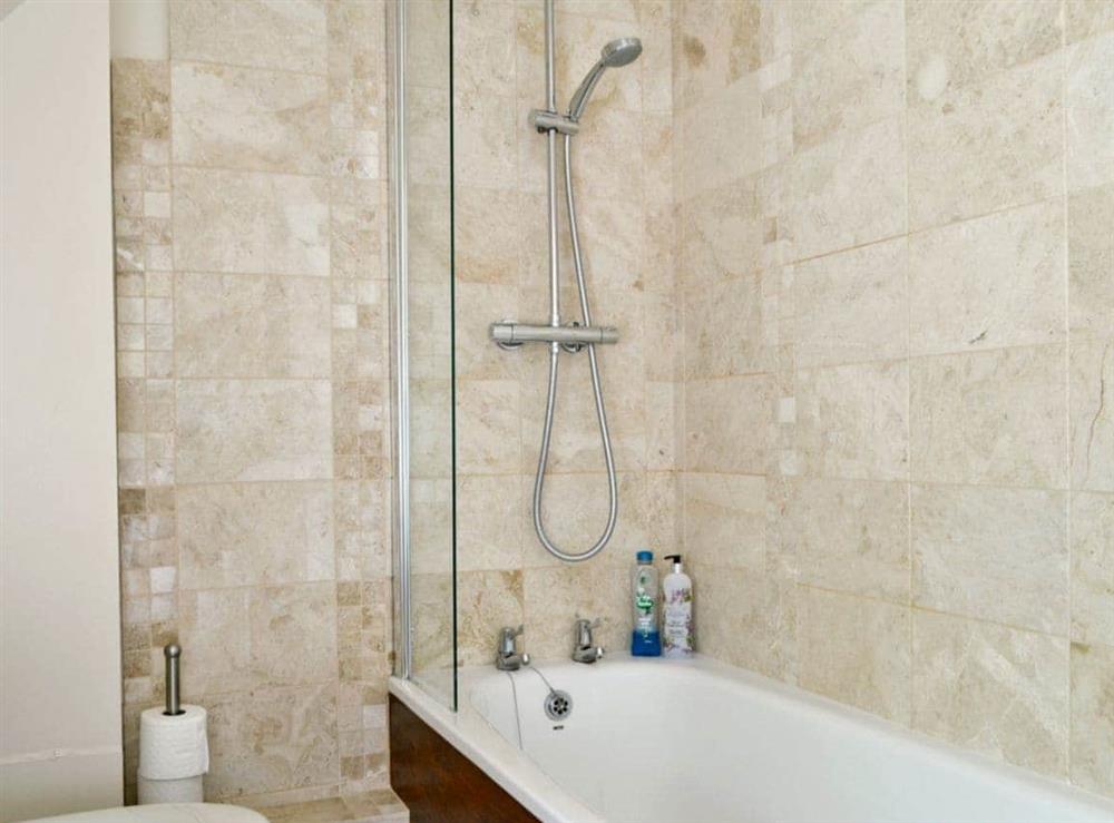 Modern bathroom with shower over bath at Rose Cottage in Westington, Chipping Campden, Glos., Gloucestershire