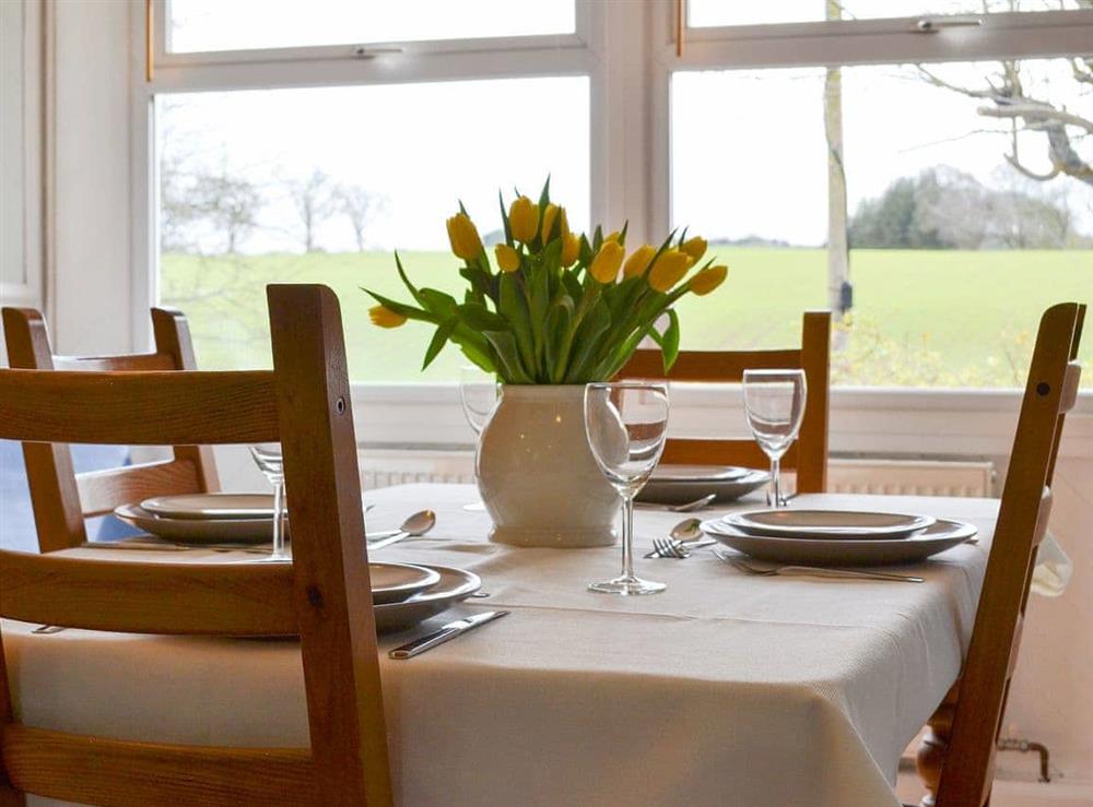 Dining area with views over the garden at Rose Cottage in Wooley, near Hexham, Northumberland