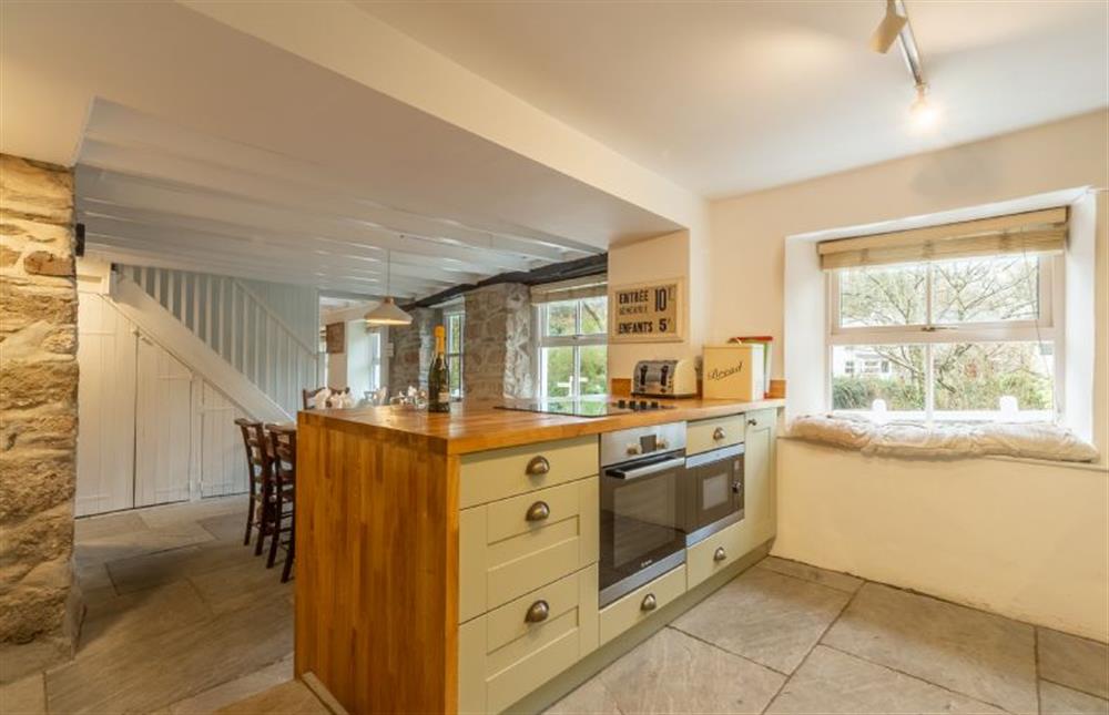 Kitchen with flagstone floor and underfloor heating at Rose in Vale Cottage, Mithian, St Agnes 