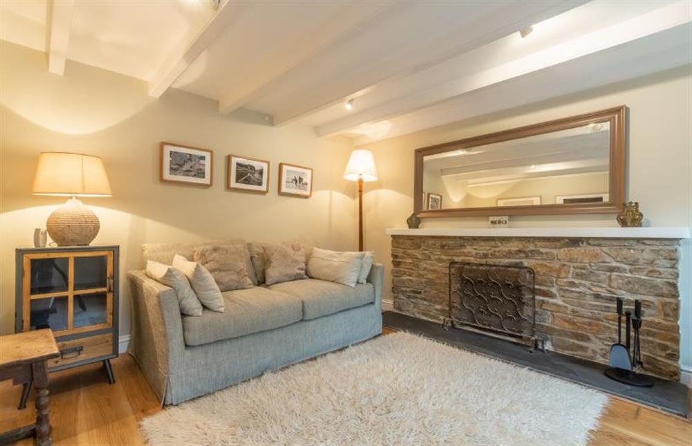 Snug with double sofa bed, television and open fire at Rose in Vale Cottage, Mithian, St Agnes 