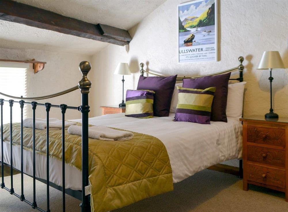 Large bedroom with double bed and additional single at Rose Patch Cottage in Keswick, Cumbria
