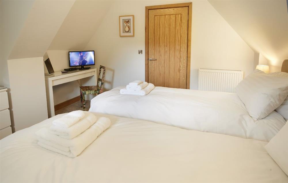 Twin bedroom with 2’6 single beds that can be converted to a 5’ Kingsize double on request