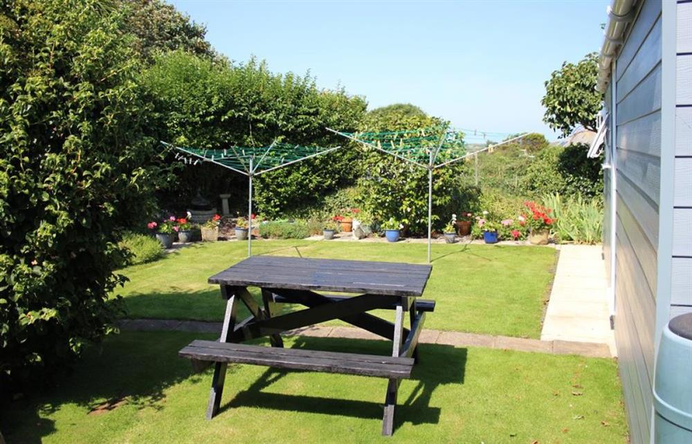 Shared sunny garden at Roseberry Cottage in Tintagel