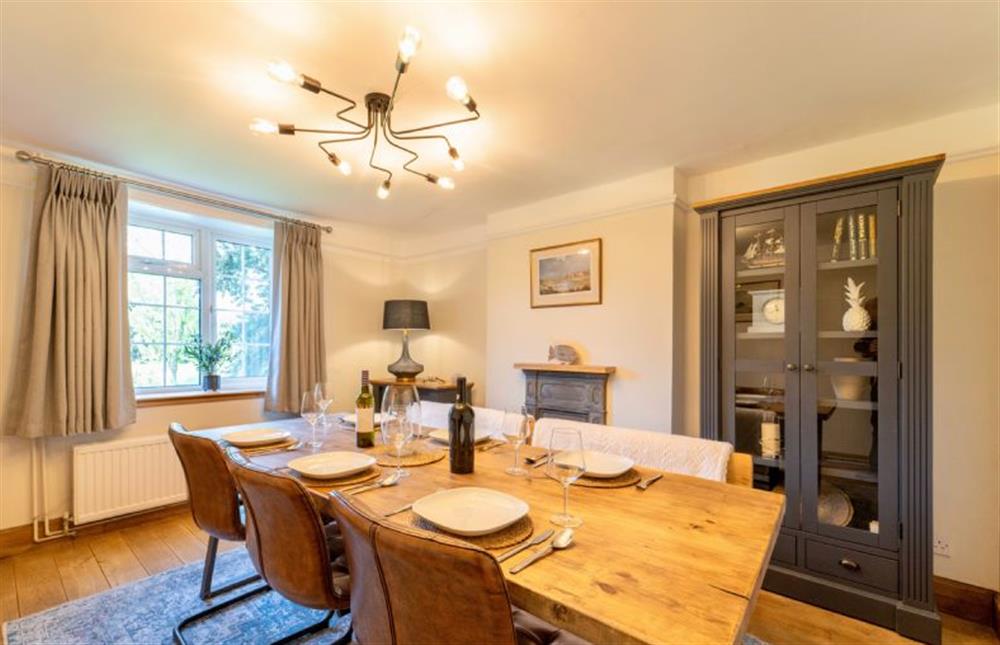 The dining table has chair and bench seating at Rosehill House, Docking near Kings Lynn
