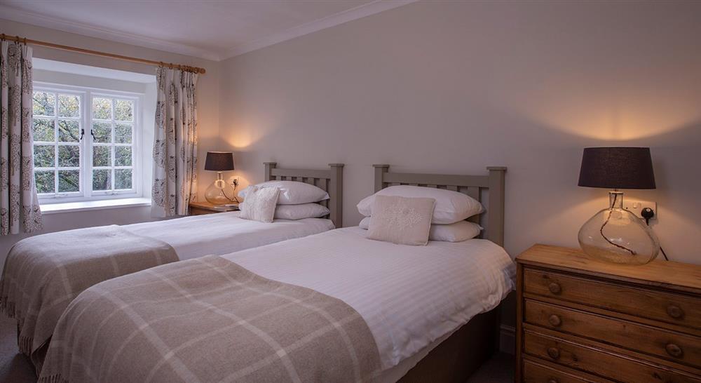 The first twin bedroom at Roseland Porth Barn in Roseland, Cornwall