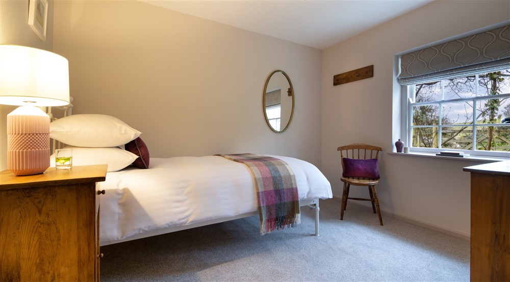 The single bedroom at Roseland Porth Farm Cottage in Truro, Cornwall