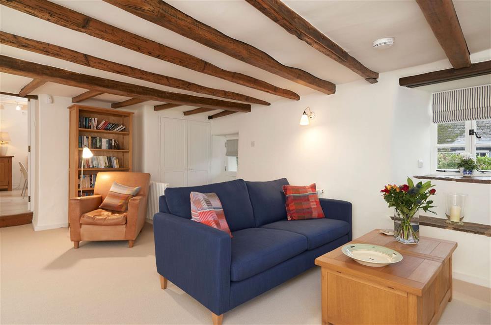 Ground floor: Sitting room with relaxed seating and bookcase at Rosemary Cottage, Dittisham