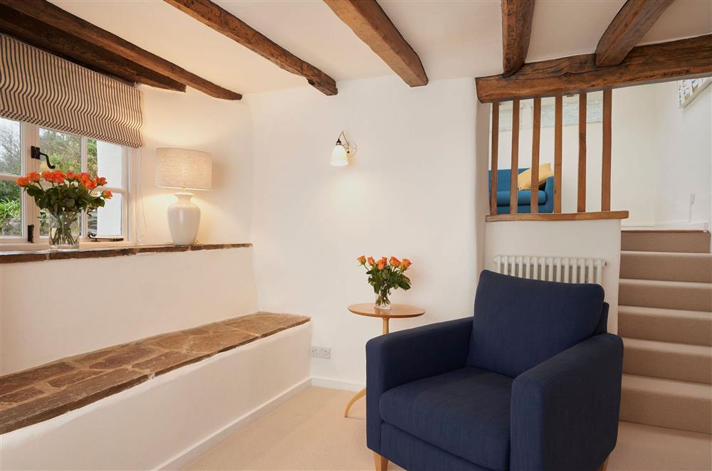 Ground floor: Sitting room with short staircase up to a quite reading space at Rosemary Cottage, Dittisham