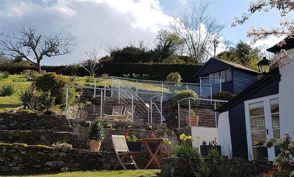 Large terraced garden at Rosemary Cottage with plenty of garden furniture and beautiful views at Rosemary Cottage, Dittisham