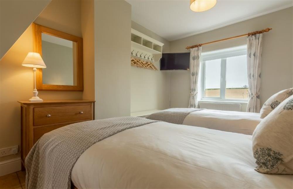 First floor: Bedroom four, twin room at Rosemary Cottage, Thornham near Hunstanton