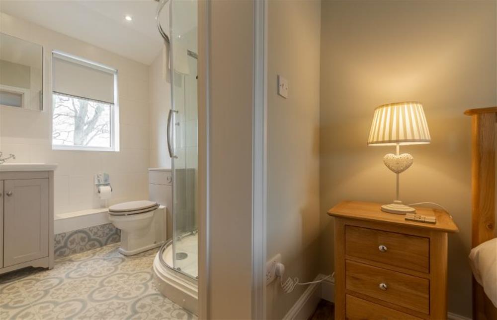 First floor: Bedroom three has an en-suite shower room at Rosemary Cottage, Thornham near Hunstanton