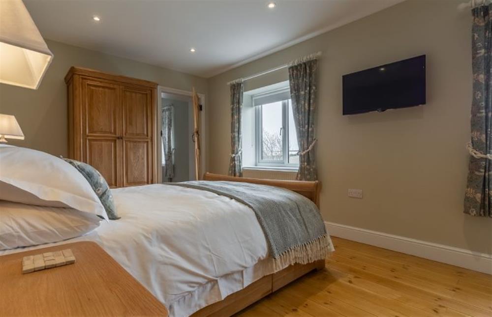 First floor: Bedroom two with double bed at Rosemary Cottage, Thornham near Hunstanton