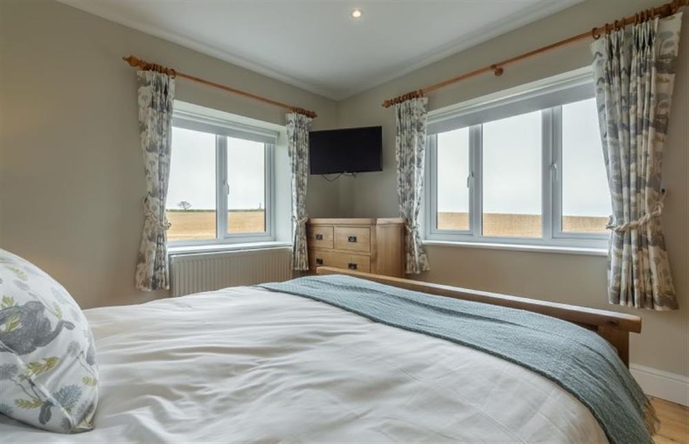 First floor: Extensive views from the master bedroom at Rosemary Cottage, Thornham near Hunstanton