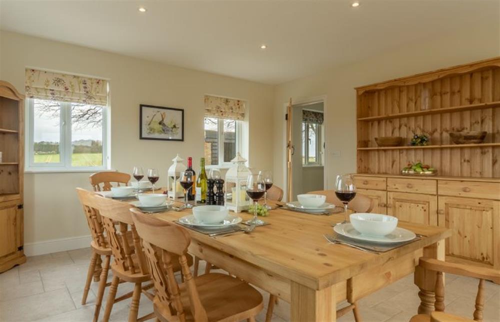 Ground floor: Dining table with seating for eight at Rosemary Cottage, Thornham near Hunstanton