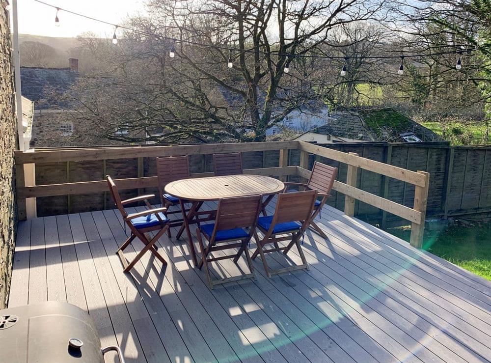 Decked area with outdoor furniture at Rosemary Cottage in Withiel, near Bodmin, Cornwall