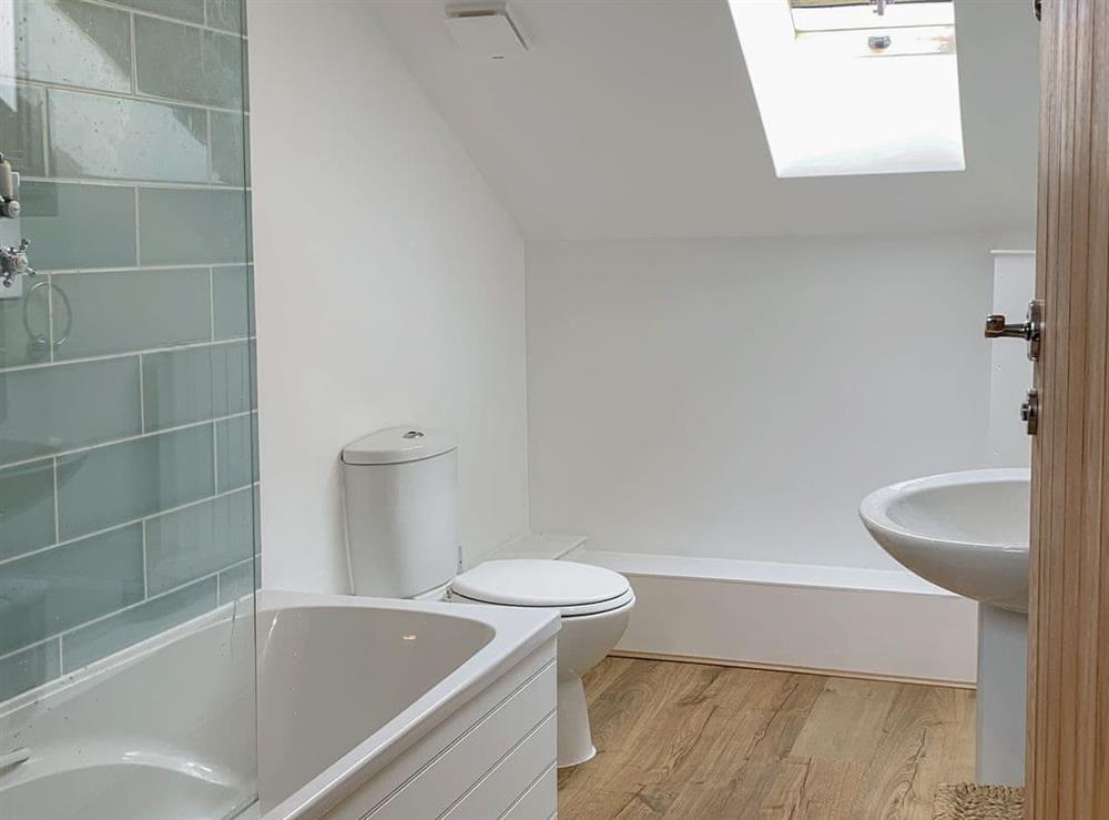 First floor family bathroom with shower over bath at Rosemary Cottage in Withiel, near Bodmin, Cornwall