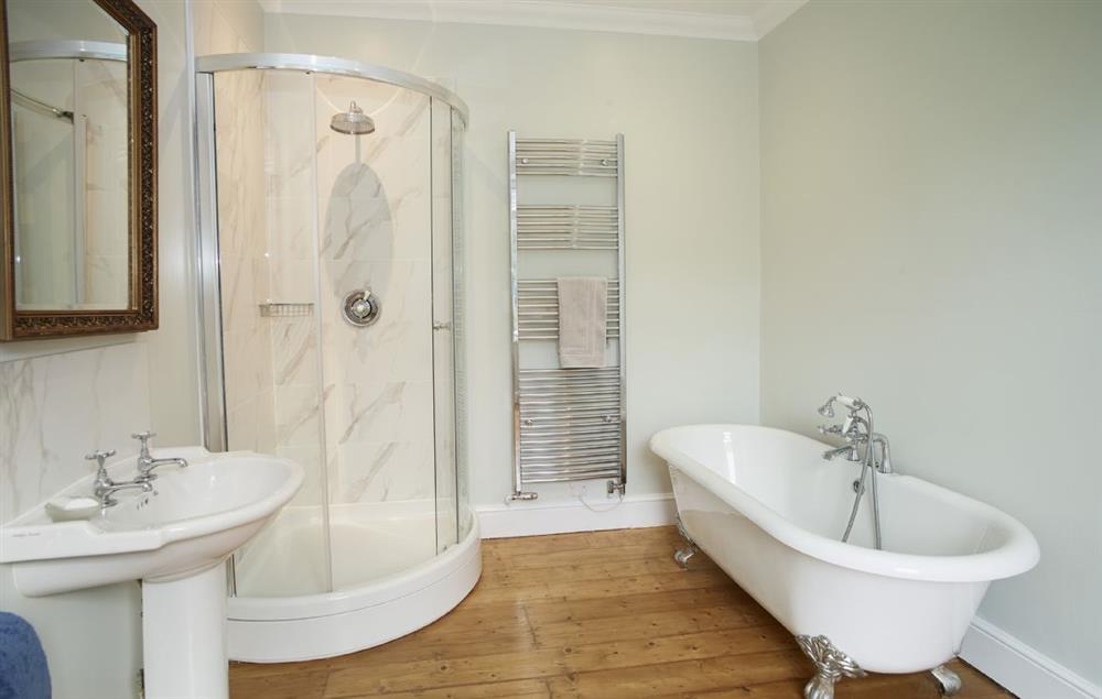 Master en-suite bathroom with roll top bath and separate shower at Rosevean House, St. Agnes