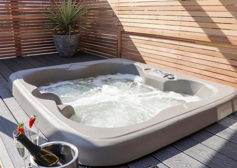 Spend some time in the hot tub at Rosewarrick Cottage, Lanivet