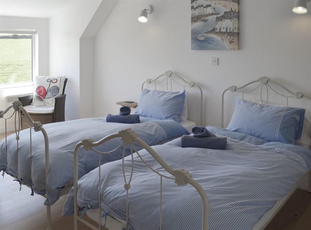 Relaxing bedroom with twin beds at Roskear in Crackington Haven, near Bude, Cornwall