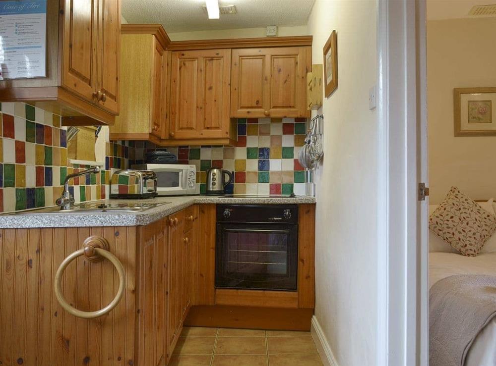 Well-equipped fitted kitchen at Ross Cottage in Polson, Launceston, Cornwall