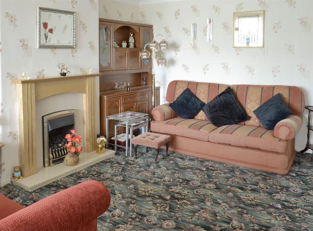 Comfy seating in living room at Rossall Beach Cottage in Rossall, near Thornton-Cleveleys, Lancashire, England