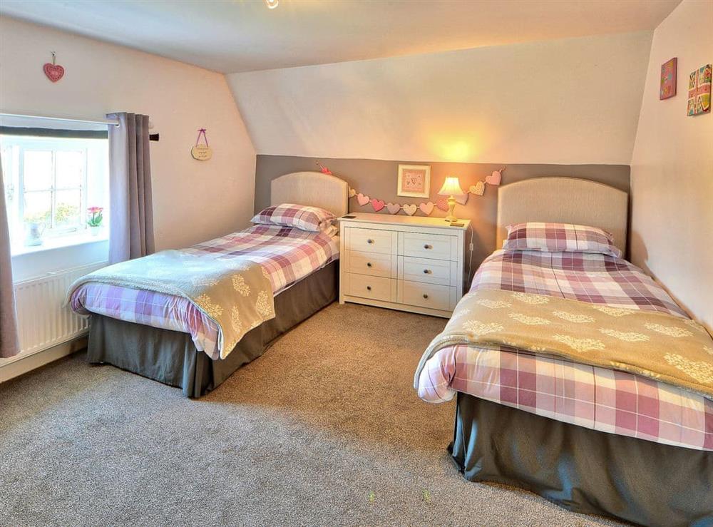 Comfortable twin bedroom at Rossiters Cottage in Wellow, near Yarmouth, Isle of Wight