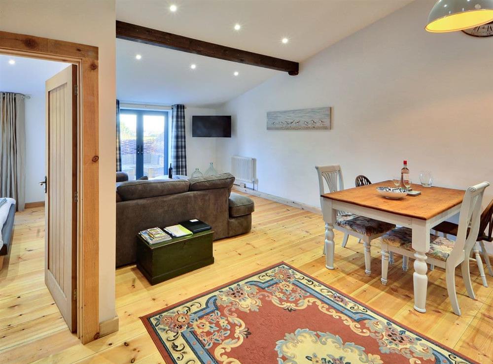 Beautifully decorated living area with French doors leading to decking at Dornfelder, 