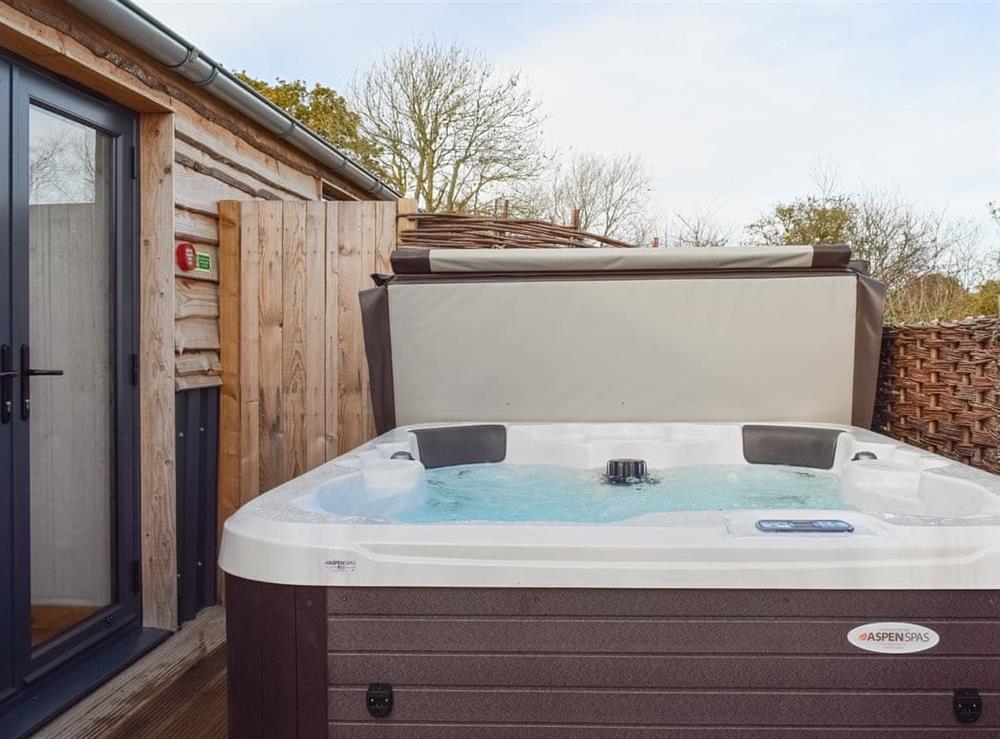Luxurious hot tub within an enclosed patio area at Rondo, 