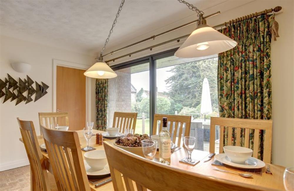 Dining room has patio doors into the garden at Rossmore, Holme-next-the-Sea near Hunstanton