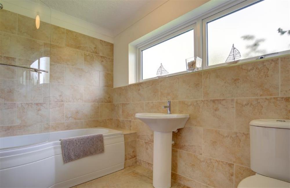 Family bathroom has bath with shower over at Rossmore, Holme-next-the-Sea near Hunstanton