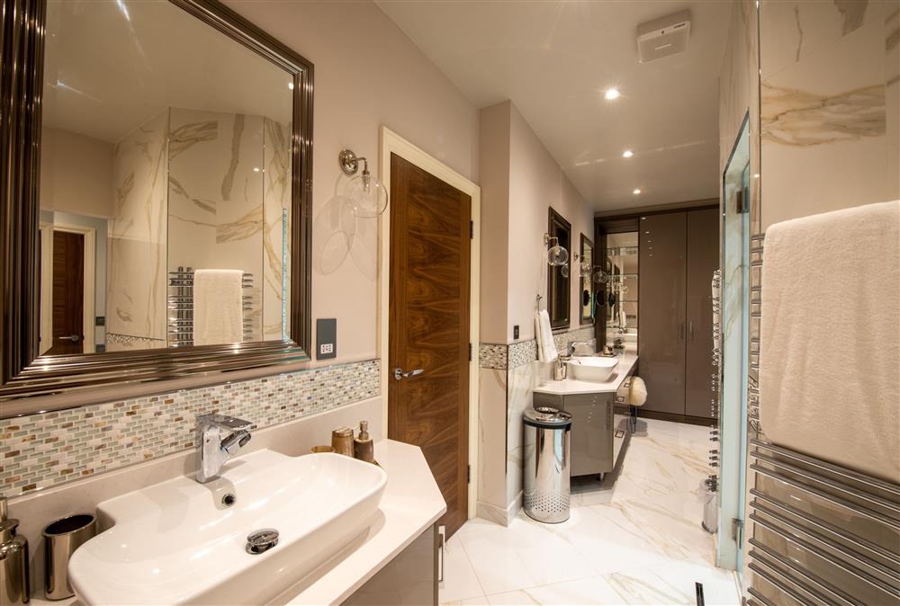 Ground floor: En-suite dressing room with steam shower and dual vanity units at Rough Creek Lodge, Charlton Marshall