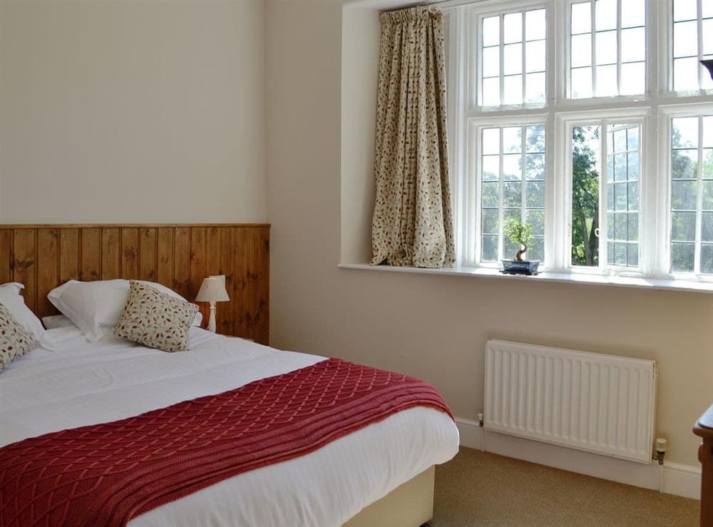 Comfortable double bedroom at The Farmhouse, 