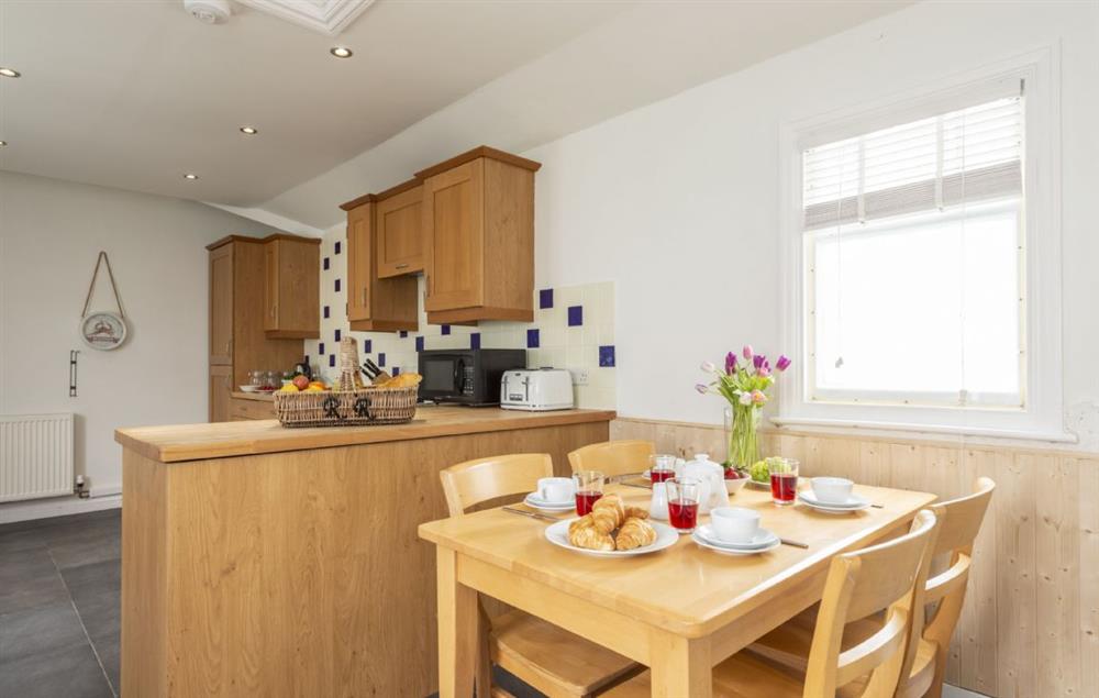 Spacious fully equipped kitchen and kitchen table at Round Island, The Lizard